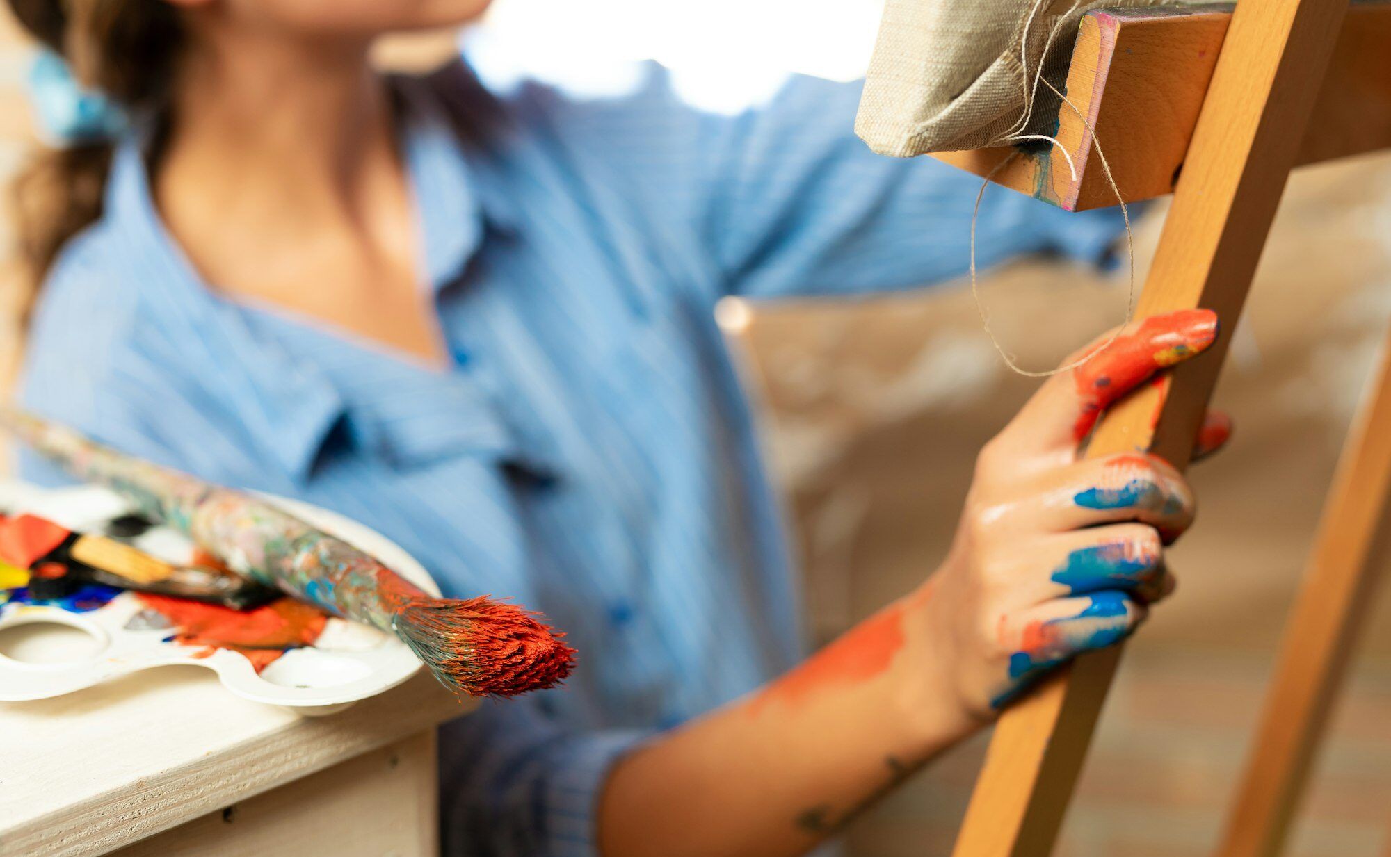 Close up of hands of creative woman is in art studio